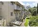 Exterior side view of townhouse complex with stairs leading to units and neatly maintained grounds at 869 Briarcliff Ne Rd # B11, Atlanta, GA 30306