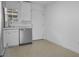 Bright kitchen features stainless steel dishwasher, white cabinetry, and an abundance of natural light at 869 Briarcliff Ne Rd # B11, Atlanta, GA 30306