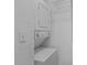 Laundry closet featuring a stackable washer and dryer and wire shelving unit at 869 Briarcliff Ne Rd # B11, Atlanta, GA 30306