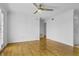 Bright living room features hardwood floors and ceiling fan at 869 Briarcliff Ne Rd # B11, Atlanta, GA 30306