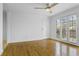 Living room featuring gleaming hardwood floors, ceiling fan, and French doors at 869 Briarcliff Ne Rd # B11, Atlanta, GA 30306
