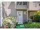 Attractive townhome with well-manicured lawn, secure ADT system, and covered entryway at 105 Governors Dr, Forest Park, GA 30297