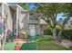 Charming townhome exterior featuring well-maintained landscaping and gray siding at 105 Governors Dr, Forest Park, GA 30297