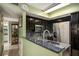 Modern kitchen featuring stainless steel appliances, dark cabinets, and ample counter space at 105 Governors Dr, Forest Park, GA 30297