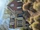 Charming two-story home with a combination of brick and siding, complemented by well-maintained landscaping at 1081 Bridgemill Ave, Canton, GA 30114