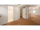 View of an attic room featuring neutral carpet, a door to a bathroom, and natural light perfect for a home office at 51 Willow Wood Se Cir, Atlanta, GA 30317