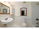 A cozy bathroom with vanity, toilet, tub, and tiled walls offering a comfortable and efficient layout at 51 Willow Wood Se Cir, Atlanta, GA 30317