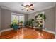 Bright bedroom with hardwood floors, ceiling fan, and large windows at 51 Willow Wood Se Cir, Atlanta, GA 30317