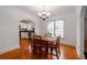 Charming dining room with chandelier, hardwood floors, and an open view to the kitchen at 51 Willow Wood Se Cir, Atlanta, GA 30317