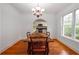 Charming dining room with a chandelier, hardwood floors, and view of the modern kitchen at 51 Willow Wood Se Cir, Atlanta, GA 30317
