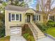 Attractive one-story home with beautiful landscaping, updated garage, and inviting front entrance at 51 Willow Wood Se Cir, Atlanta, GA 30317