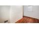 Well-lit room with painted brick feature, hardwood flooring, and traditional trim at 51 Willow Wood Se Cir, Atlanta, GA 30317