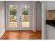 Kitchen area with hardwood flooring and door leading to outdoor deck at 51 Willow Wood Se Cir, Atlanta, GA 30317