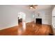 Bright living room features hardwood floors, a fireplace, and a view of the dining area at 51 Willow Wood Se Cir, Atlanta, GA 30317