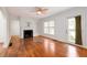 Bright living room features hardwood floors, a fireplace, and a doorway to the outside at 51 Willow Wood Se Cir, Atlanta, GA 30317