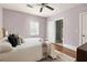 Bedroom with ceiling fan, hardwood floors, neutral color palette, and ensuite bathroom at 891 Spencer Nw St, Atlanta, GA 30314