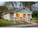Quaint home with covered porch, landscaped yard and flower boxes at 891 Spencer Nw St, Atlanta, GA 30314