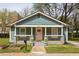 Charming bungalow featuring a covered front porch, craftsman details, and a well-maintained lawn at 891 Spencer Nw St, Atlanta, GA 30314