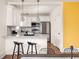Charming kitchen featuring stainless steel appliances, sleek countertops, and a breakfast bar at 891 Spencer Nw St, Atlanta, GA 30314