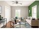 Comfortable living room with hardwood floors, neutral paint, large windows, and stylish furniture arrangement at 891 Spencer Nw St, Atlanta, GA 30314