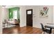 Inviting living room featuring stylish decor, hardwood floors, and a view into the dining area at 891 Spencer Nw St, Atlanta, GA 30314