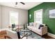 Bright living room featuring hardwood floors, stylish decor, and large windows for natural light at 891 Spencer Nw St, Atlanta, GA 30314