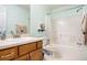 Clean bathroom featuring a bathtub, shower, and a well-lit vanity at 1019 James Madison Ct, Mcdonough, GA 30253