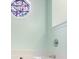 Bathroom close-up with stained glass accent window over the bathtub at 1019 James Madison Ct, Mcdonough, GA 30253