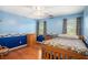 Cozy bedroom features wood floors, ample light, and classic decor at 1019 James Madison Ct, Mcdonough, GA 30253