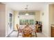 Bright breakfast nook featuring a round table, four wooden chairs and a view of the backyard at 1019 James Madison Ct, Mcdonough, GA 30253