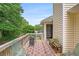 Relaxing outdoor deck with seating and a decorative rug offers a peaceful space to enjoy the fresh air at 1019 James Madison Ct, Mcdonough, GA 30253