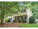 Charming two-story home with stone accents and lush greenery in a well-maintained front yard at 1019 James Madison Ct, Mcdonough, GA 30253