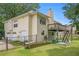 View of a house with a raised deck, stairs, and a well-maintained lawn at 1019 James Madison Ct, Mcdonough, GA 30253