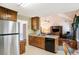 Well-lit kitchen featuring wood cabinets and stainless steel refrigerator at 1019 James Madison Ct, Mcdonough, GA 30253