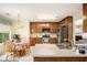 Functional kitchen featuring ample wood cabinetry, stainless steel appliances and a breakfast table at 1019 James Madison Ct, Mcdonough, GA 30253