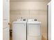 Convenient laundry room featuring modern washer and dryer units at 1019 James Madison Ct, Mcdonough, GA 30253