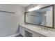 Bright bathroom featuring dual sinks, granite countertops, and a large mirror at 102 Defoors Mill Dr, Atlanta, GA 30318