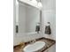 Elegant bathroom featuring a marble countertop, sleek sink, and a large mirror, creating a spa-like retreat at 102 Defoors Mill Dr, Atlanta, GA 30318
