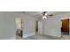 Bedroom featuring ensuite bathroom, walk-in closet, neutral carpet, and ceiling fan at 102 Defoors Mill Dr, Atlanta, GA 30318