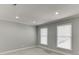 Spacious bedroom with recessed lighting, offering natural light through the bright windows at 102 Defoors Mill Dr, Atlanta, GA 30318