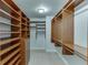 Spacious walk-in closet with custom wood shelving and built-in storage at 102 Defoors Mill Dr, Atlanta, GA 30318
