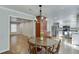 Bright kitchen with stainless steel appliances, white cabinetry, and eat-in dining area at 102 Defoors Mill Dr, Atlanta, GA 30318