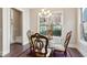 Cozy dining room area with stylish chandelier, hardwood floors, and natural light at 2172 Haventree Ct, Lawrenceville, GA 30043