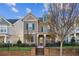 Charming two-story home featuring a well-manicured lawn and a brick and wrought iron fence at 2172 Haventree Ct, Lawrenceville, GA 30043