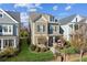 Charming two-story home showcasing the landscaped yard, attractive facade, and inviting front porch at 2172 Haventree Ct, Lawrenceville, GA 30043