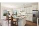 Bright kitchen with stainless steel appliances, granite countertops, and ample cabinet space at 2172 Haventree Ct, Lawrenceville, GA 30043