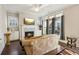 Comfortable living room featuring a fireplace, built-in shelving, and large windows for abundant sunlight at 2172 Haventree Ct, Lawrenceville, GA 30043