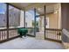 Covered patio with screens featuring concrete flooring, neutral colors, and outdoor views at 2172 Haventree Ct, Lawrenceville, GA 30043