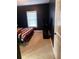 Bedroom with carpet and window, complemented by a dark blue accent wall at 227 Shellbark Dr, Mcdonough, GA 30252