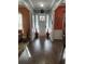 Bright foyer with views into the dining room and living room and showcasing the hardwood floors at 227 Shellbark Dr, Mcdonough, GA 30252